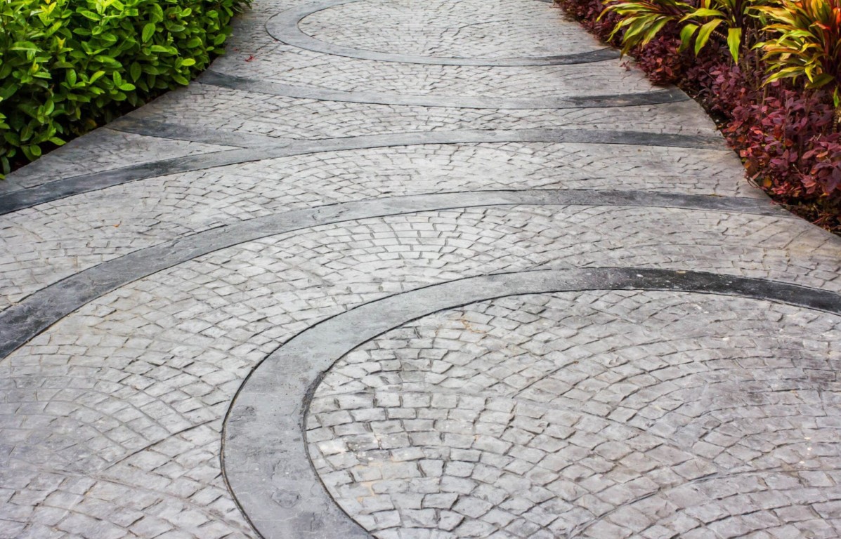 Stamped decorative concrete walkway with circular pattern